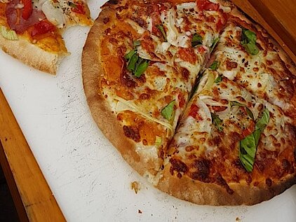 Pizza aus dem Holzofen